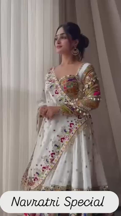 High definition retail showcase video displaying mirror shine and four meter flare twirl of white muslin silk lehenga - WishTown Fashion Club