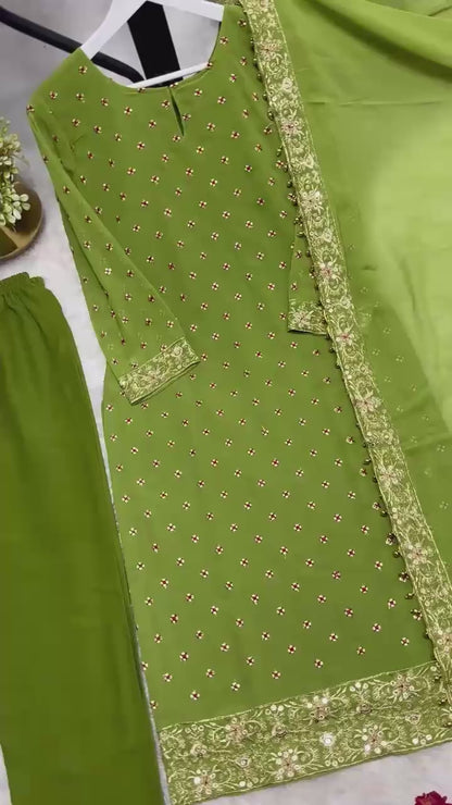 High definition retail display video highlighting the brilliant sparkle of both side sequence embroidery and the effortless movement of the green traditional dress under lights.