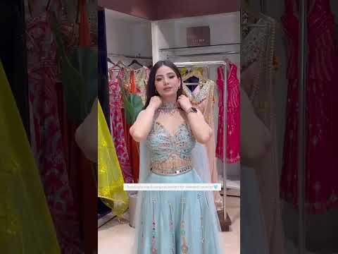 High definition retail showcase video displaying multi thread sequins shine and drape of sky blue Rangoli silk set - WishTown Fashion Club